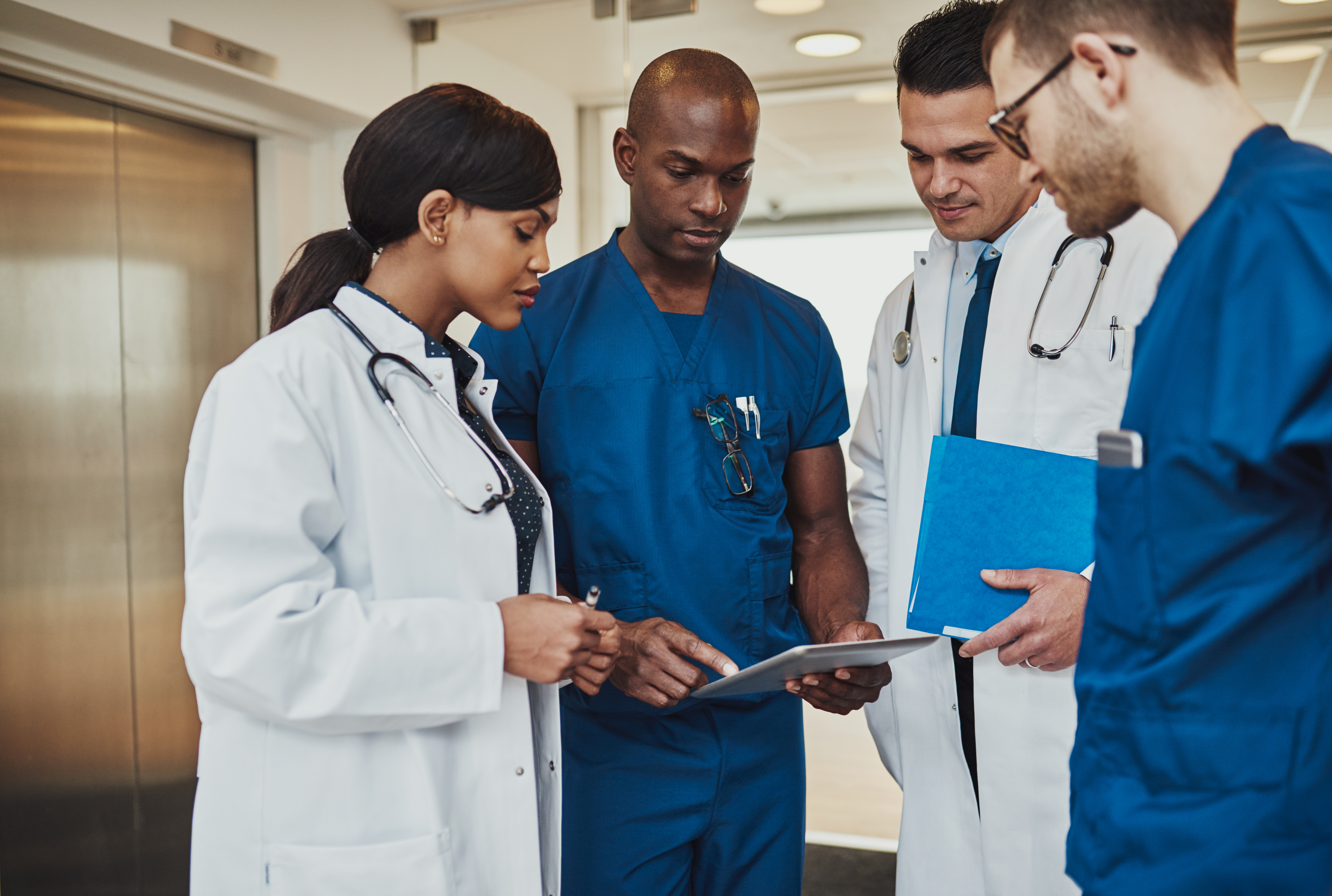 Team of doctors discussing a patient file