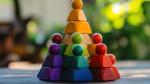 Wooden figurines in different colours arranged in a pyramid