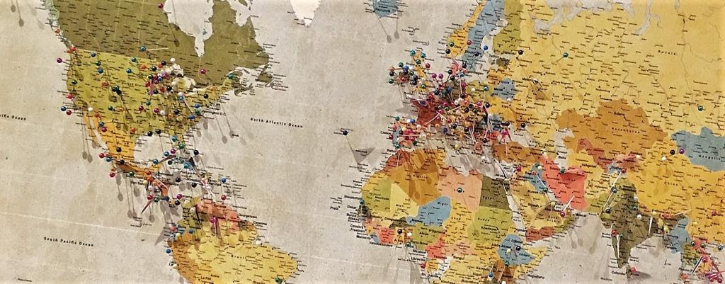 word map with several coloured pins