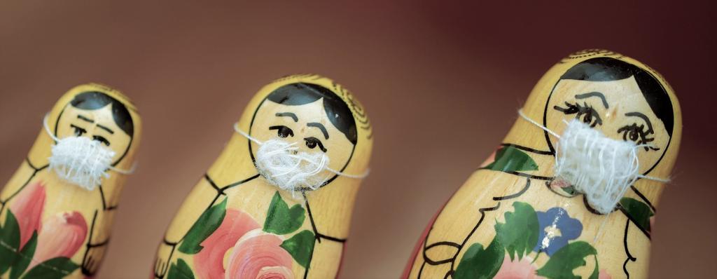 matryoshka, Russian hollow wooden doll, with protection mask