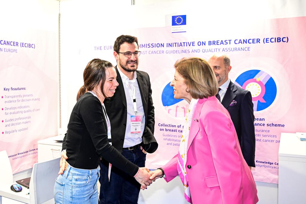 At the EBCC14 conference in Milan in March 2024 Members of the Healthcare Quality group shaking hands with Commissioner Kyriakides