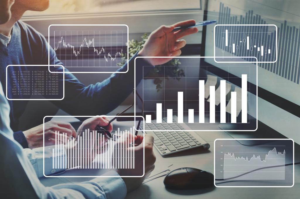 Image of two people at a desk looking at a graph on a screen, with different graph types superimposed over the image