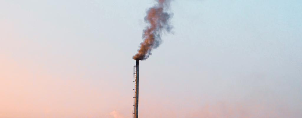 Polluting chimney in a blue sky